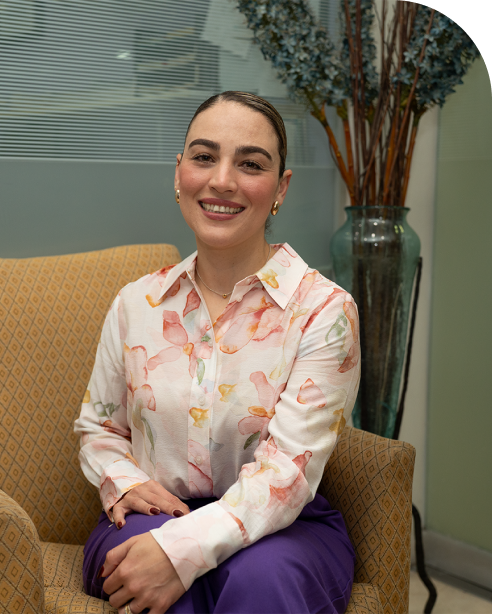 woman smiling and posing for a photograph