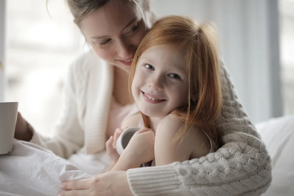 A mother holding her baby, representing the importance of insurance for future protection